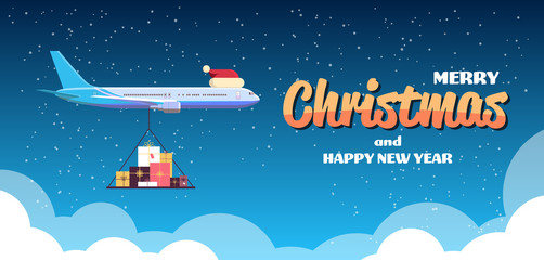 airplane with red santa hat flying with colorful gift present boxes merry christmas happy new year w