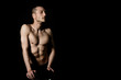 © vladorlov - Young attractive guy. Black background.