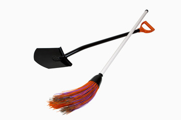 Black shovel and plastic broom