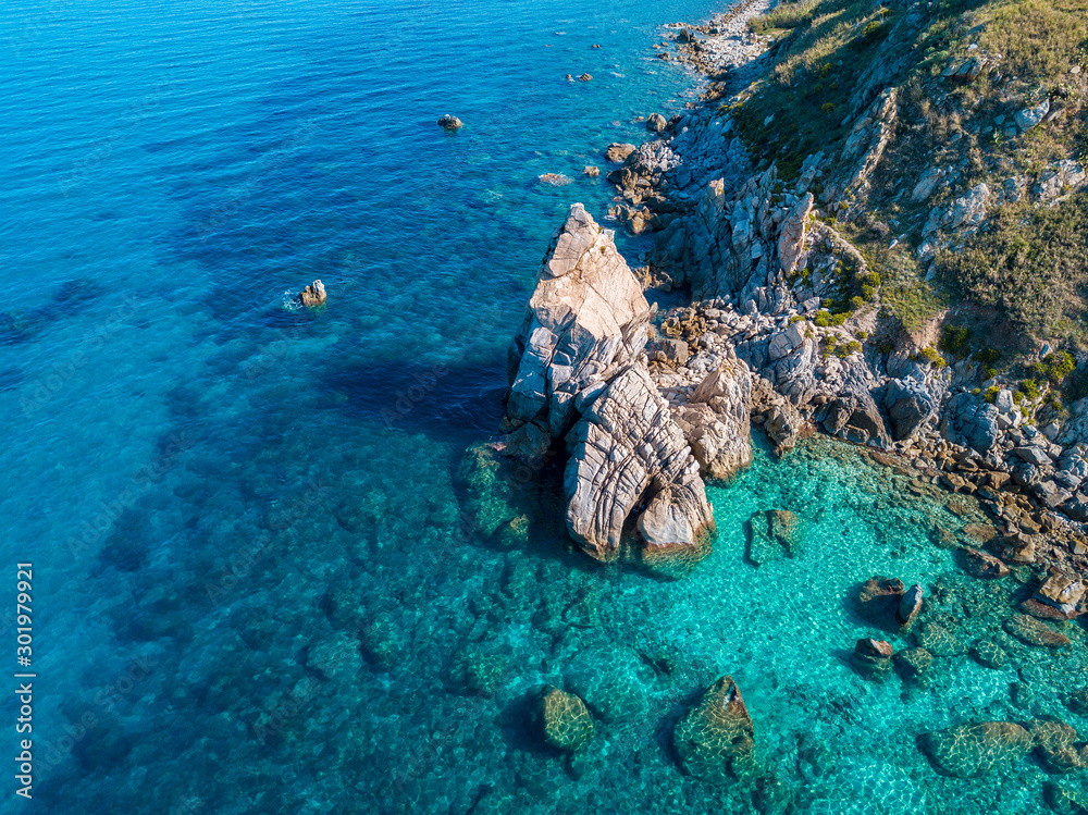 Aerial view of Tropea beach, crystal clear water and rocks that appear ...