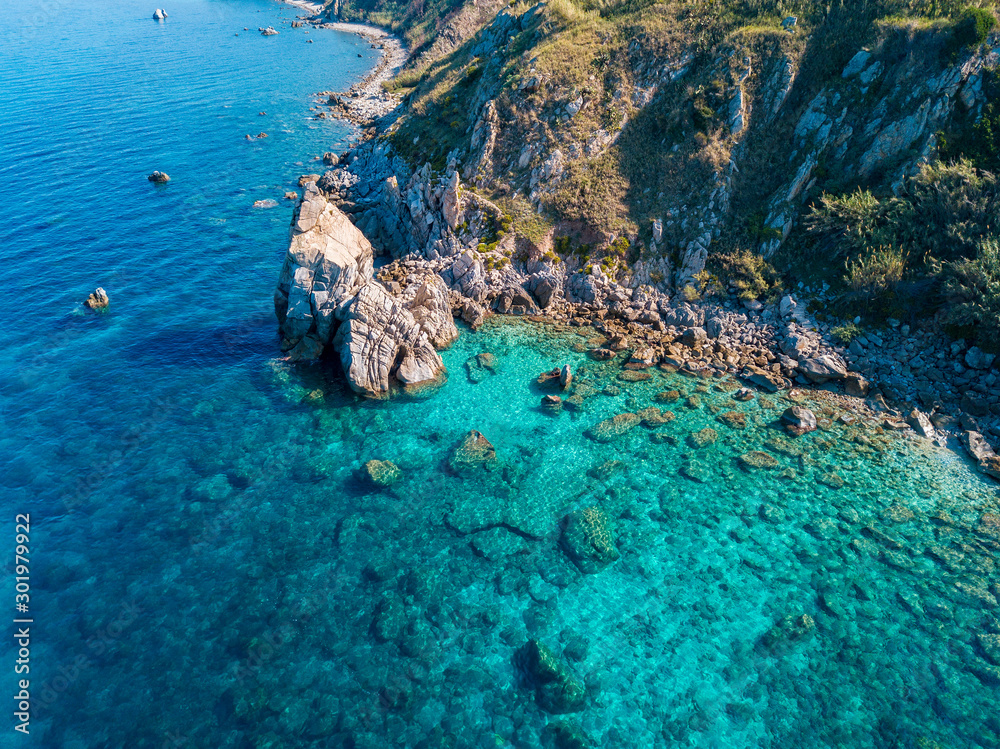 Aerial view of Tropea beach, crystal clear water and rocks that appear ...