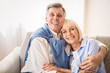 © Prostock-studio - Tender moments. Romantic senior couple sitting on couch