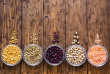 Lentils, Peas, Beans, Chickpeas On A Wooden Background.