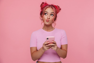 Poster - Portrait of thoughtful young woman with colored hair holding cellphone