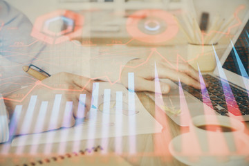 Multi exposure of stock market graph with man working on laptop on background. Concept of financial analysis.