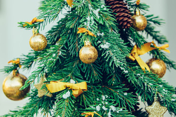 Wall Mural - Green fir tree with golden balls. Christmas wallpaper.