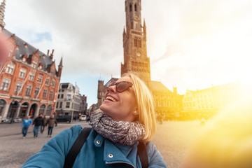 Wall Mural - Woman at the central Market Square in Bruges, Belgium