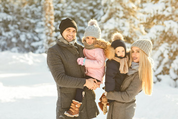  Family smiling in winter in a park
