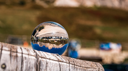 Crystal ball alpine landscape shot at the famous Grödner Joch, South Tyrol, Italy