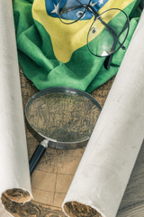 Aufkleber - An old colonial map of South America and the flag of Brazil with a magnifying glass and old-fashioned glasses.  Vintage style