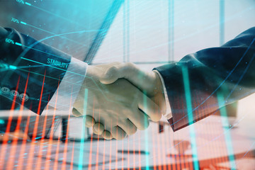 Multi exposure of financial graph on office background with two businessmen handshake. Concept of success in business