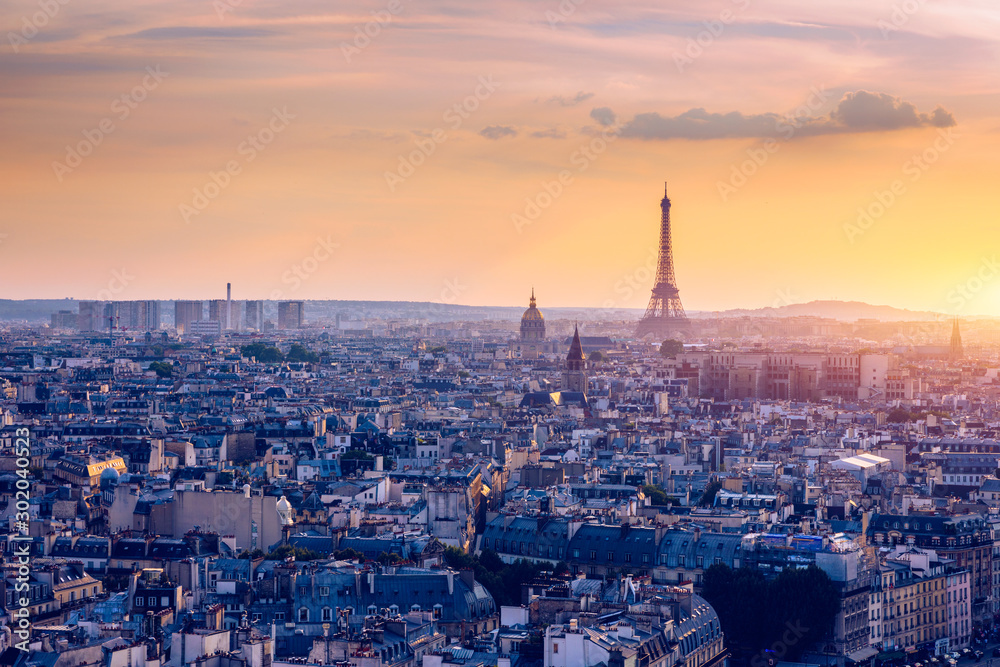 Panoramic aerial view of Paris, Eiffel Tower and La Defense business district. Aerial view of Paris at sunset. Panoramic view of Paris skyline with Eiffel Tower and La Defense. Paris, France. - obrazy, fototapety, plakaty 