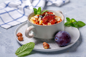 Wall Mural - Organic millet porridge with caramelized plums.