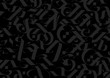 © ae - Black background with gray gothic letters. Gloomy pattern for text and fabric.