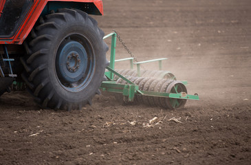 Poster - Tractor harrowing soil