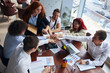 © alfa27 - Successful team of caucasian business co-workers gahered to discuss business idea, and finally after discussing joined hands together in sign of lucky, successful work