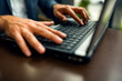© Novak - Business Person Typing On Laptop Keyboard