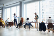 © alfa27 - Successful and ambitious business man make presentation to creative business team gathered in office