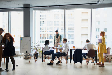 busy multi-ethnic business people working together in coworking space, diverse employees staff, business team talking together in office, project team corporate teamwork concept