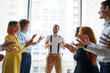 © alfa27 - Happy business team clap their hands to co-worker for his great job, business people concept. Panoramic window in office background