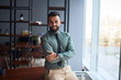 © alfa27 - portrait of confident young handsome middle eastern businessman standing in office, looking at camera, successful team leader wearing formal wear, posing for photo at workplace