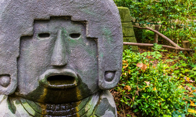 stone inca statue with water coming out its mouth, ancient cultur