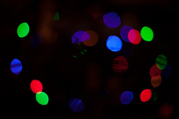 Wall Mural - Defocused colored Christmas lights