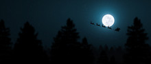 Santa Claus Flying In His Sleigh Over The Moon