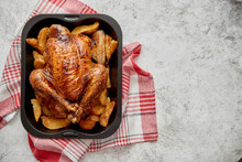 Roasted Chicken Or Turkey With Potatoes In Black Steel Mold