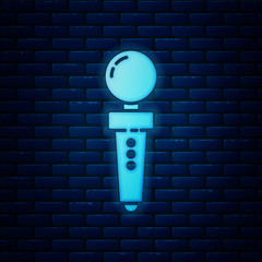 Glowing neon Joystick for arcade machine icon isolated on brick wall background. Joystick gamepad. Vector Illustration