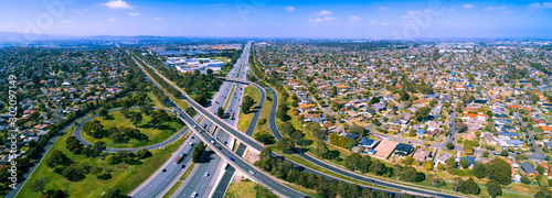Cuadros en Lienzo Scenic aerial panorama of highway interchange in greater Melbourne suburbs on su