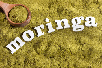 Canvas Print - Organic moringa powder - Word moringa in wooden letters