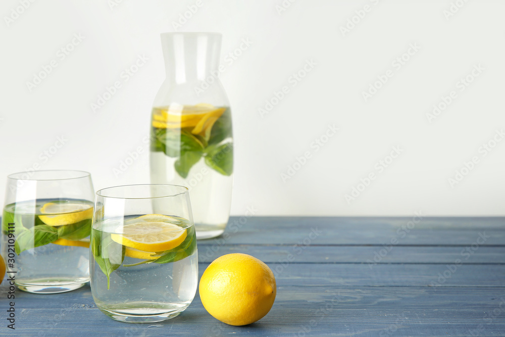 Glasses of fresh lemonade on table