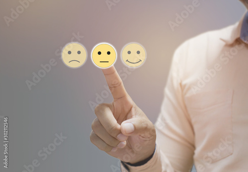 Fotomural Businessman pressing sad face touch screen , Business Service Satisfaction conce