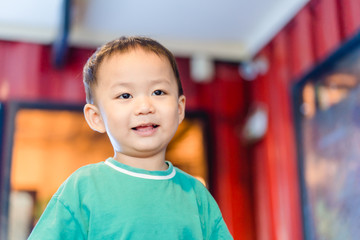 Wall Mural - portrait of a cute little boy talking with his mother in restaurant