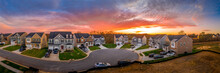 Aerial View Of New Construction Cul-de-sac Dead-end Street With Luxury Houses In A Maryland Upper Middle Class Neighborhood American Real Estate Development In The USA With Stunning Sunset Orange Sky