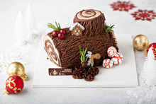 Christmas Yule Log Cake With Edible Sweet Mushrooms And Pine Cones