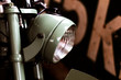 closeup photo of round headlight motorcycle. classic motorbike have old design in vintage style