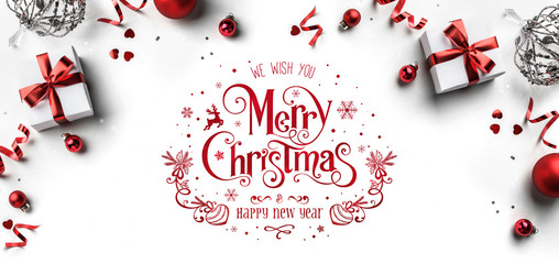 Wall Mural - merry christmas and new year text on white background with gift boxes, ribbons, red decoration, boke