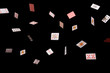Game cards strew on a black background. Isolate. banner. Many playing cards of different suits on a black background. Close-up, opy space.    