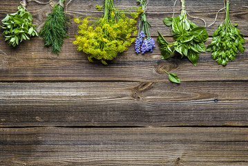 Wall Mural - Various herbs from the garden on wooden table. Fresh herb, top view, flat lay