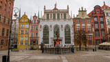 Fototapeta Miasto - Artus Court with Neptune fountain at the Long Market of Gdansk in Poland. 