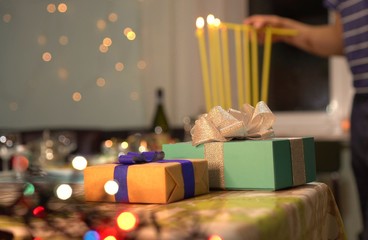 Lighting the eight candles in the menorah.  Chanukah is the Jewish eight-day, wintertime “festival of lights,” celebrated with a nightly menorah lighting, special prayers and fried foods