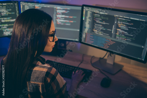 Photo of serious confident focused girl concentrated on hacking the security cod Poster Mural XXL