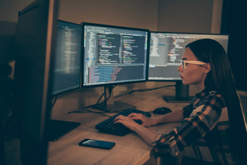 Wall Mural - Side profile photo of interested concentrated woman with cellphone lying beside her looking through script written before her in eye glasses