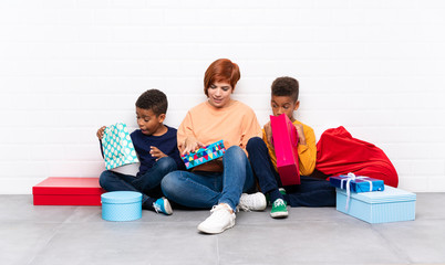 Poster - African American kids with their mother among many gifts for christmas holidays