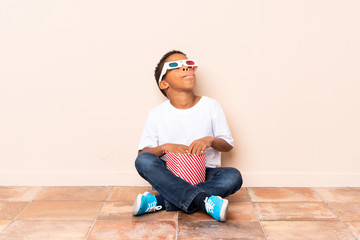 Wall Mural - African American boy  holding popcorns