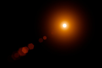 star, sun with lens flare on dark background