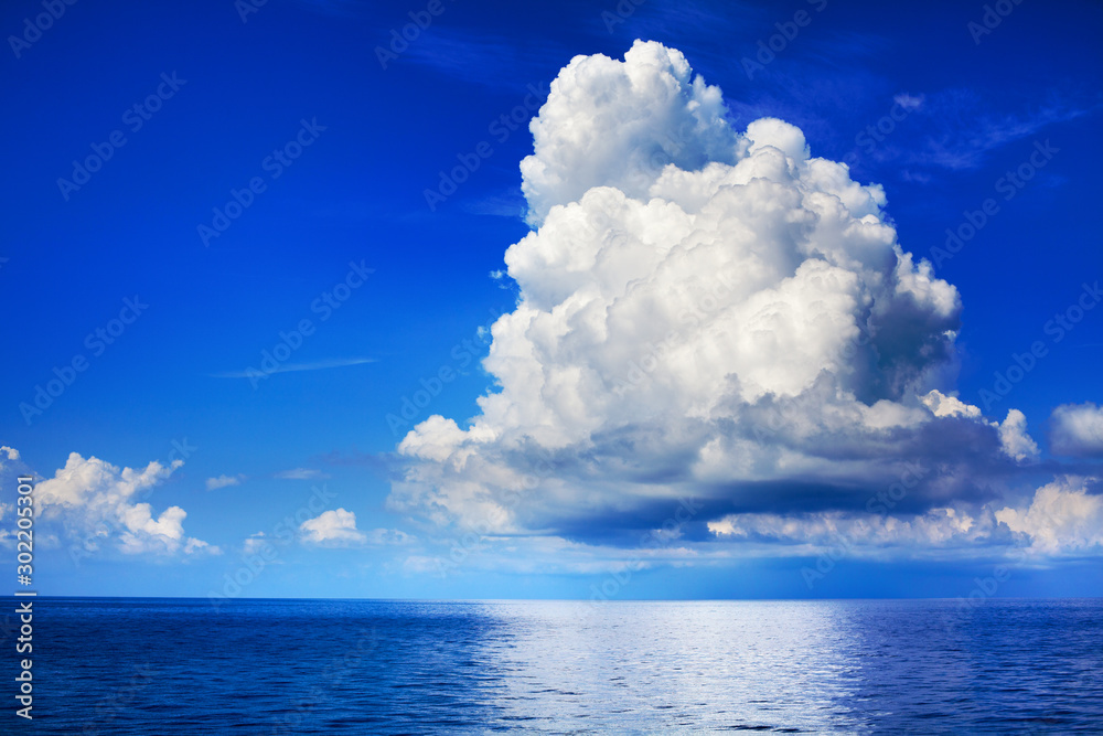 White cumulus clouds over sea close up blue sky background landscape ...