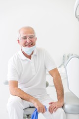 Confident dentist waiting for patient in clinic